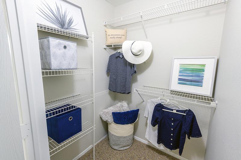 Walk-In Closet | Bedrooms feature walk-in closets with built-in organizers.