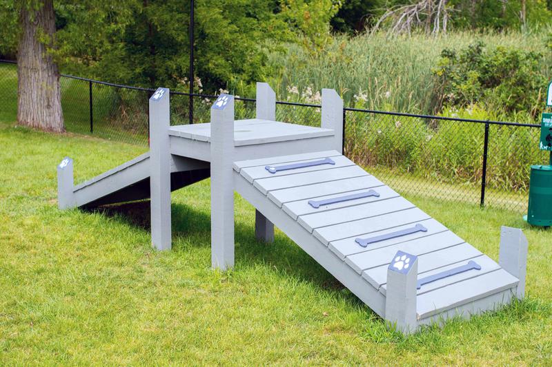 Off-Leash Dog Park | Our off-leash dog park features plenty of agility equipment for your dog to get some exercise.
