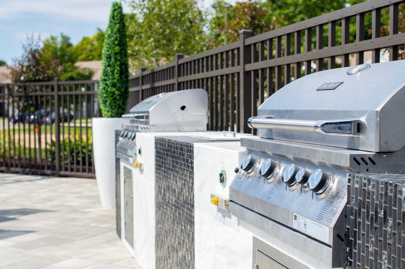 Gas Grills | Our poolside outdoor kitchen features 2 gas grills.