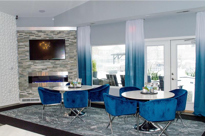 Clubhouse Fireplace | Have a seat in our clubhouse by the fireplace overlooking our resort-style pool.
