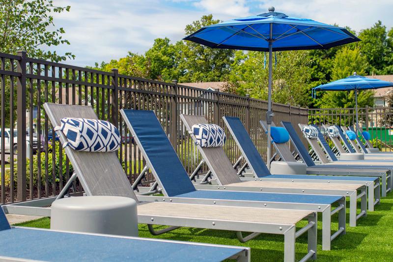 Poolside Loungers | Relax on one of our poolside loungers and soak in the sun.