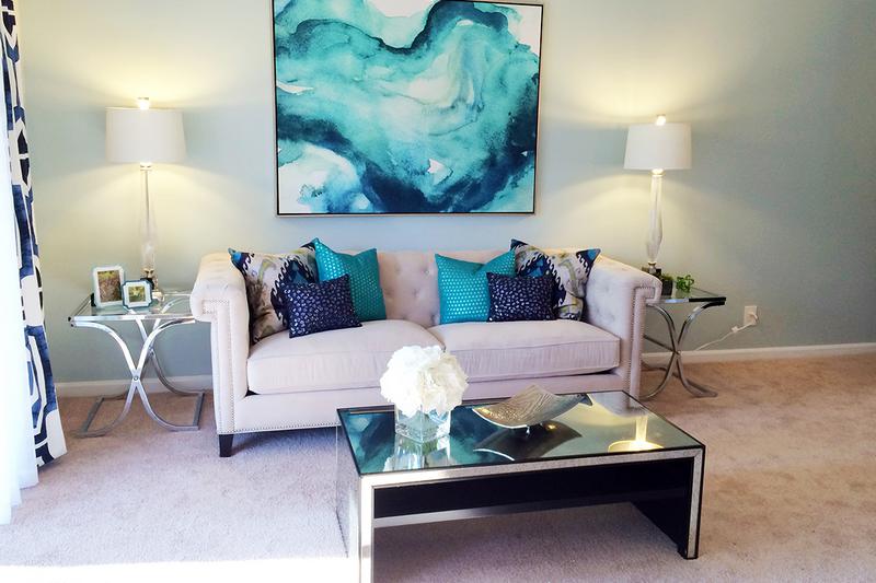 Living Room | Spacious living rooms featuring plush carpeting.