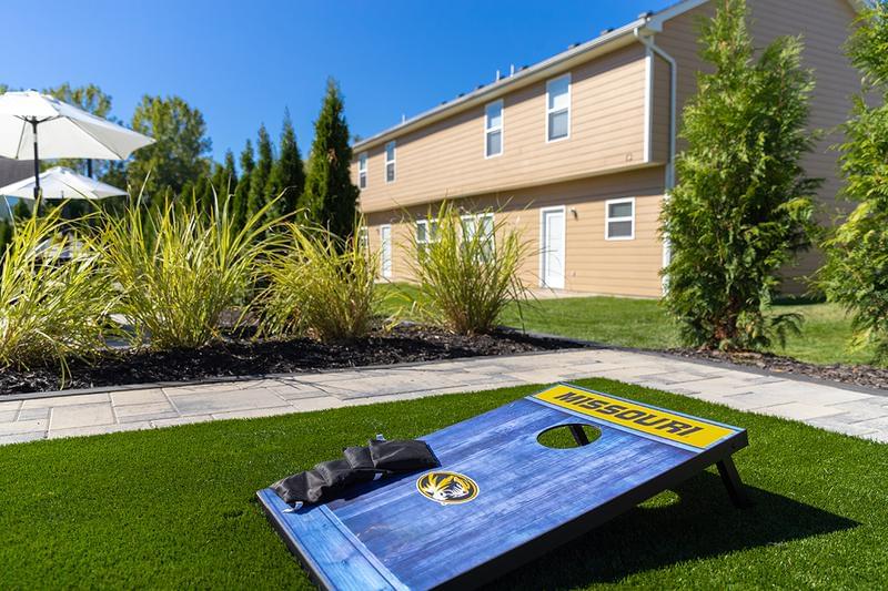 Cornhole | Play a game of cornhole with friends next to our new Hammock Garden.