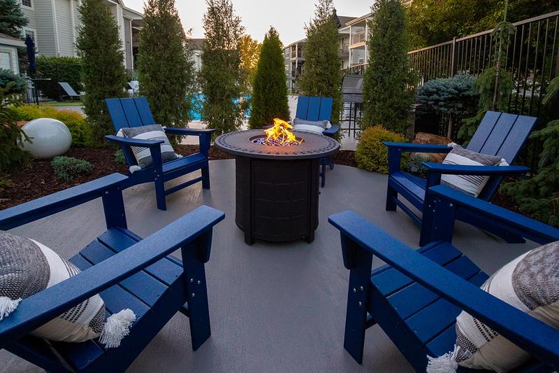 Poolside Fire Pit | Wind down and relax by our fire pit by the pool.