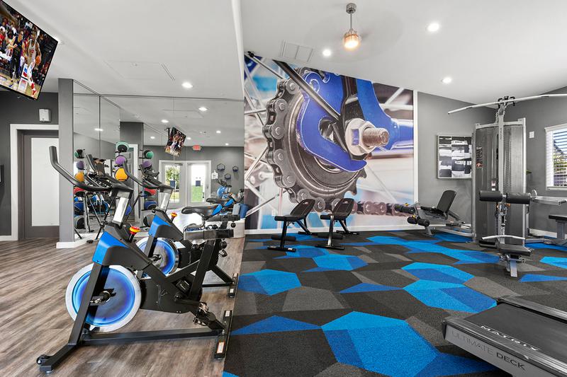 Spinning Bikes | Our fitness center also features spinning bikes .