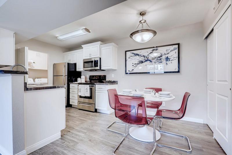 Separate Dining Room | Separate dining area featuring wood-style flooring and contemporary lighting.