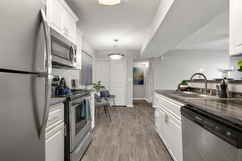 Fully Equipped Kitchens | Upgraded kitchens include a refrigerator, dishwasher, microwave, stove and ample cabinet space for storage.