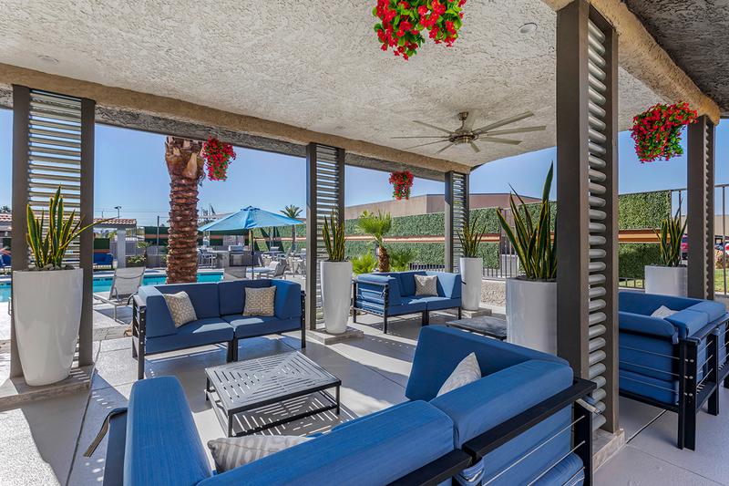 Poolside Seating Area | Enjoy our poolside seating area and get some shade.