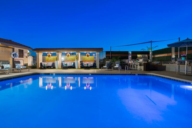 Poolside at Night | Enjoy beautiful views at night at our lit up pool area.
