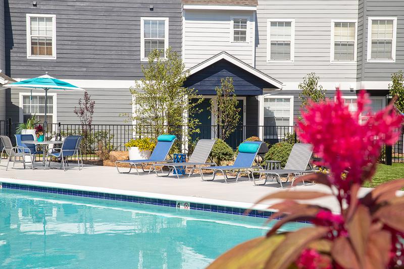 Poolside Seating | Resort style swimming pool with modern upgrades.