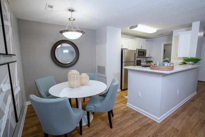 Dining Room | Your new kitchen features a breakfast bar that opens up to the living and dining areas. Separate dining area is located next to the kitchen featuring wood-style flooring.