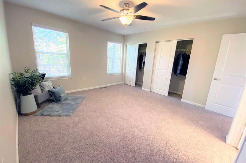 Master Bedroom | Spacious master bedrooms featuring a ceiling fan and walk-in closet.