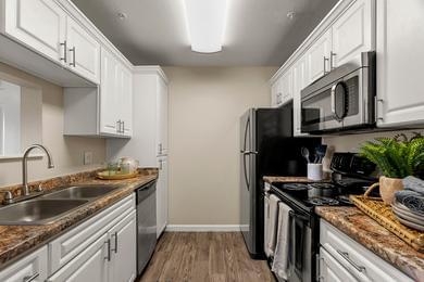 Galley Style Kitchens | If you love to cook, then our galley-style kitchen is perfect for you, equipped with stainless steel appliances and plenty of counter space!
