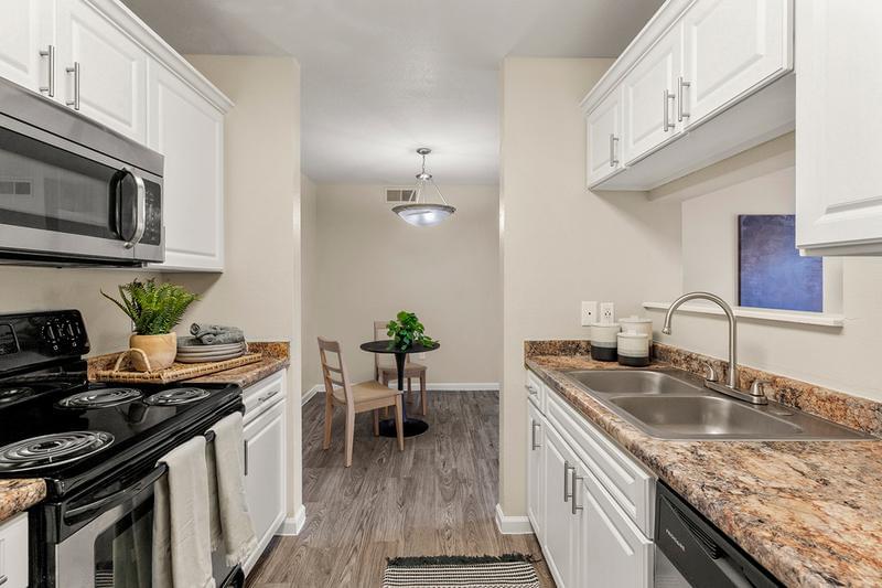 Stainless Steel Appliances | The kitchen offers plenty of cabinet space as well and opens up into the dining and living room; perfect for entertaining!