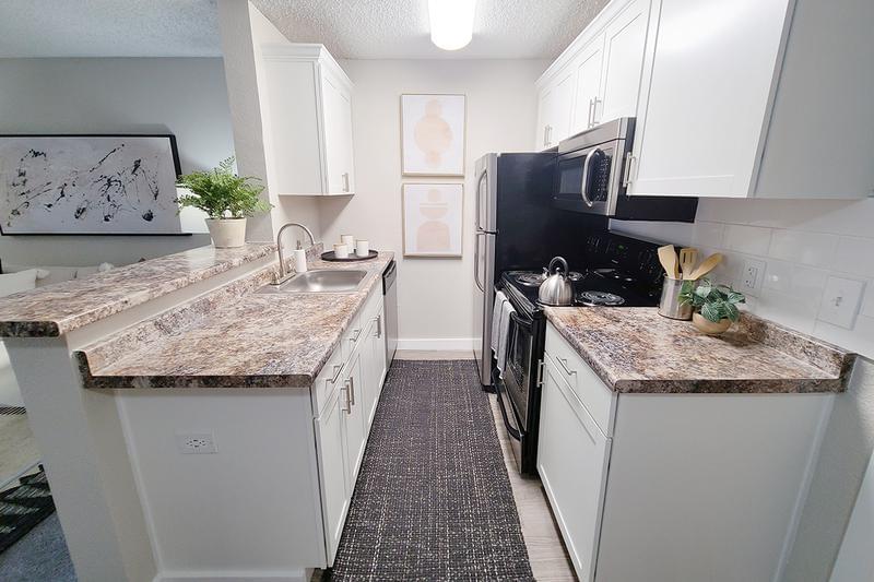 Kitchen | Fully equipped kitchens, perfect for your inner chef. Your new kitchen has a breakfast bar looking out into the dining and living room areas.