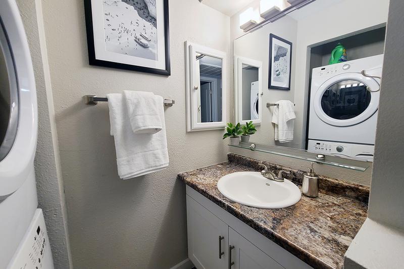 Bathroom | Newly renovated bathrooms featuring a large mirror and a medicine cabinet.