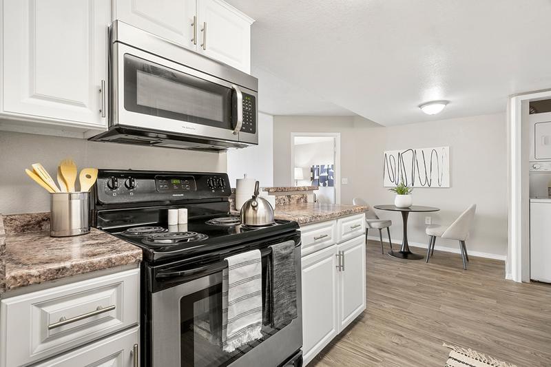 Stainless Steel Appliances | Our remolded kitchens feature granite-style counter tops, wood-style flooring, and stainless steel appliances.