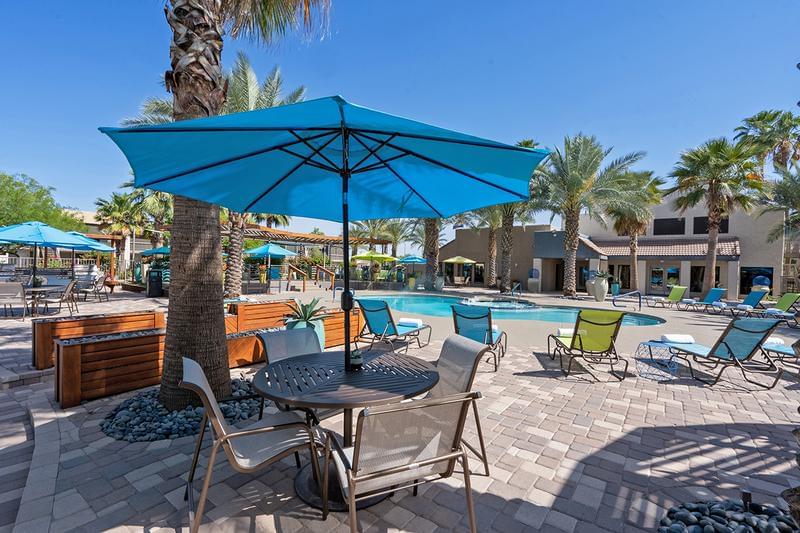 Pool Area | Spacious pool area with plenty of poolside seating and tables.