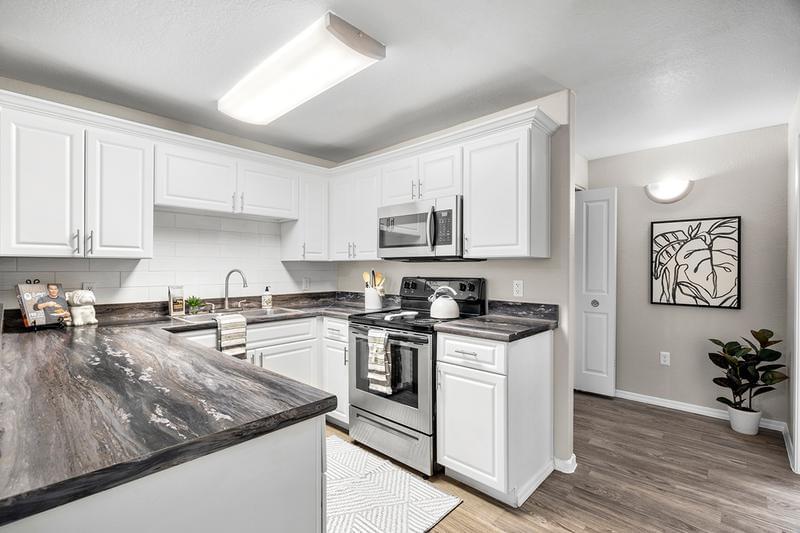 Chef Inspired Kitchen | Large, open kitchen with new stainless steel appliances and ample amounts of storage space. We are excited to offer in-person tours while following social distancing and we encourage all visitors to wear a face covering.