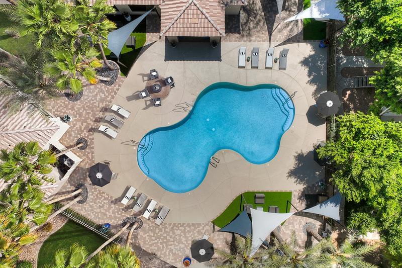 Aerial View of Sundeck | Resort-style pool with expansive sundeck and sunsails.