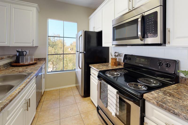 Stainless Steel Appliances | Kitchens feature all stainless steel appliances, including a dishwasher. 