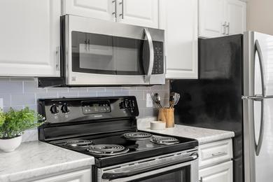 Stainless Steel Appliances and Tile Backsplash | All apartment homes are complete with stainless steel appliances and gorgeous tile backsplash.