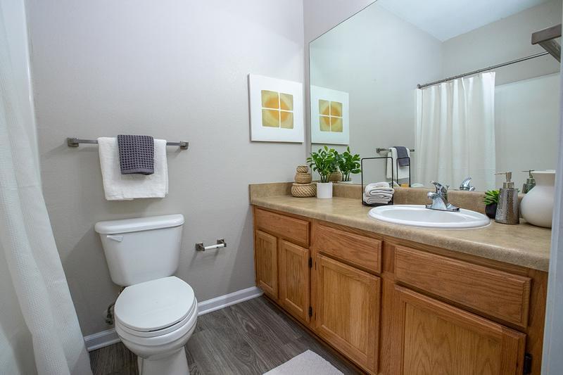 Bathroom | INTERIOR RENOVATIONS COMING SOON! Bathrooms feature oversized vanities and large mirrors.