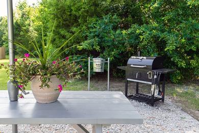 Picnic Area | Have a cookout at our picnic area featuring a picnic table and charcoal grill.