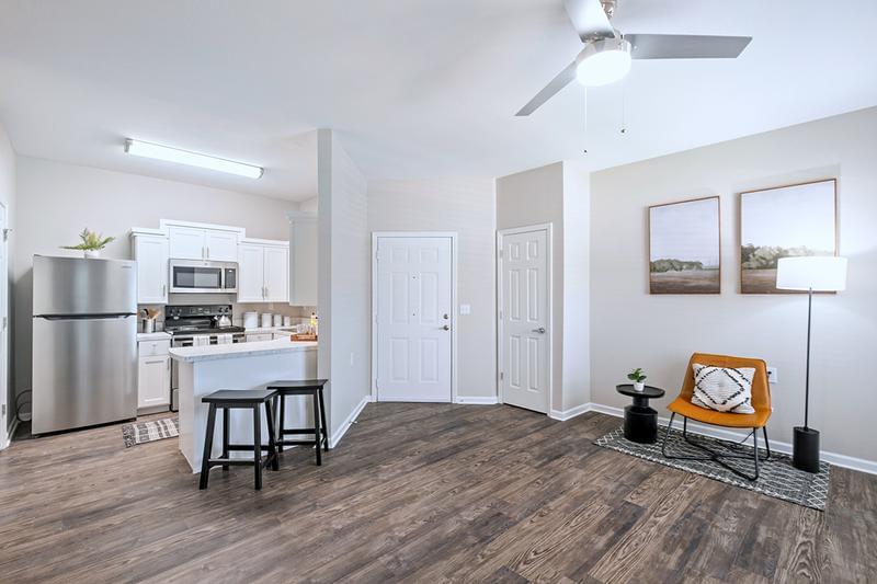 Open Floor Plans | Spacious open floor plans featuring wood-style flooring in select homes and additional closet space.