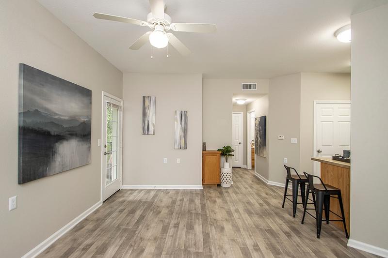 Open Floor Plans | Our spacious floor plans feature wood-style flooring, plush carpeting and multi-speed ceiling fans.
