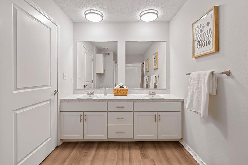 Dual Guest Bathroom | In select floorplans, bathrooms include his and her sinks with separate mirrors and cabinets for additional storage.