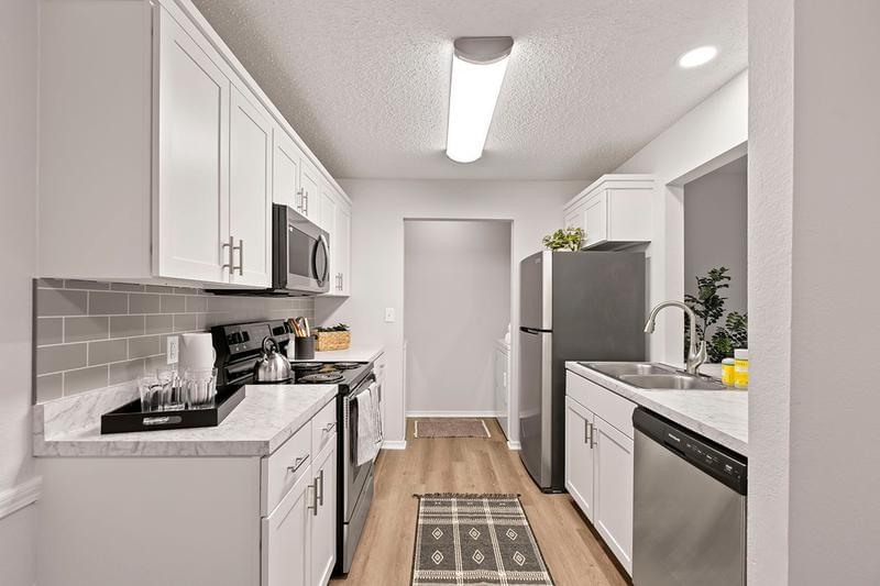 Galley Style Kitchens | Our kitchens are designed for comfort, convenience as well as entertainment.  Your laundry room is also located at the end of your galley style kitchen.