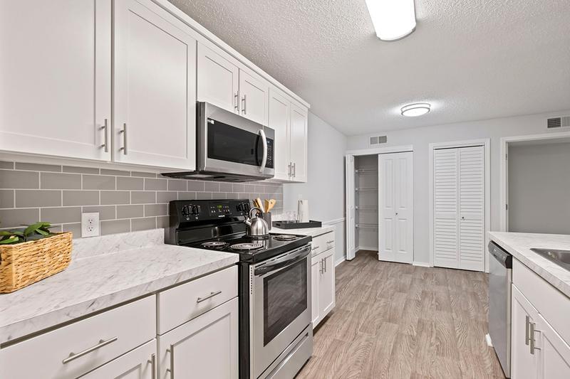 Separate Dining Area | A dining space with additional storage closets is situated close to your fully equipped kitchen.