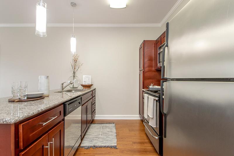 Fully Equipped Kitchen | Comfortably cook, relax and entertain in our one bedroom galley style kitchen overlooking a spacious living room.