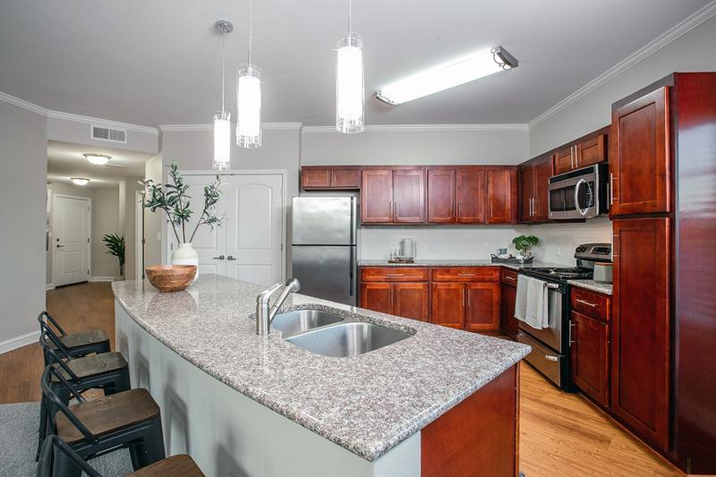 Ample Cabinetry and Stainless Steel Appliances | Kitchens feature ample cabinetry for all of your storage needs, as well as beautiful stainless steel appliances including a microwave, stove, dishwasher and fridge.