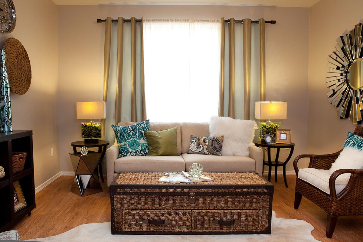 Spacious, open living rooms with large windows allowing natural sunlight to shine through.