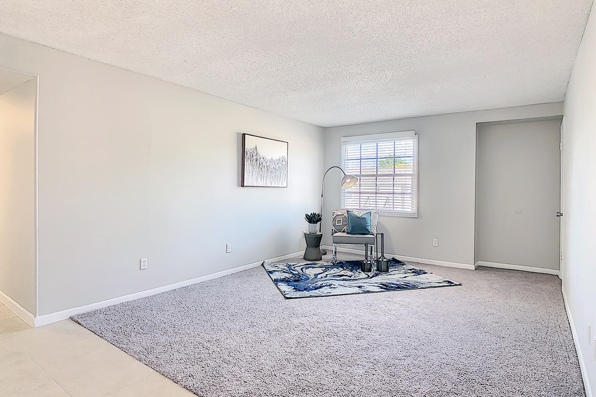 Spacious living rooms with plush carpeting.