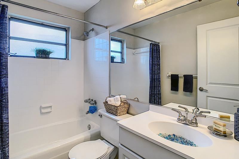 Bathroom | Bathrooms featuring updated countertops and cabinets and large mirrors.