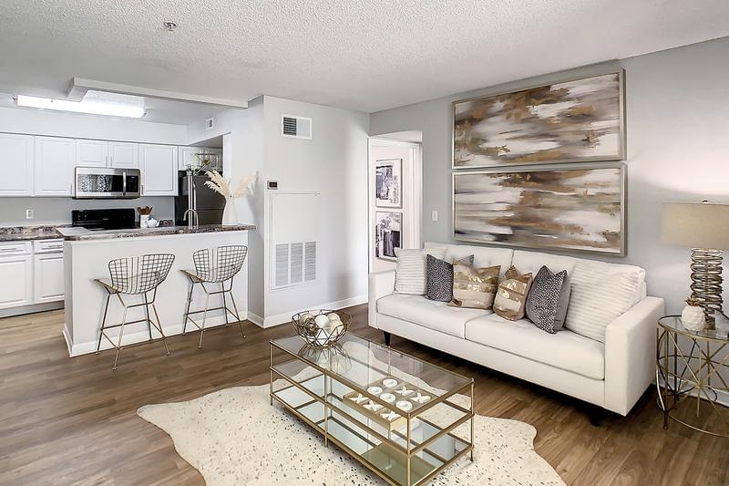 Open Floor Plans | We are excited to offer in-person tours while following social distancing and we encourage all visitors to wear a face covering. Enjoy open floor plans with wood-style flooring for a modern appeal.