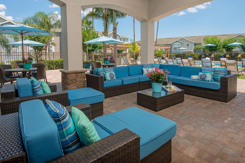 Outdoor Patio | Relax in the shade under out outdoor patio next to the pool, or sit at one of our many tables with umbrellas.