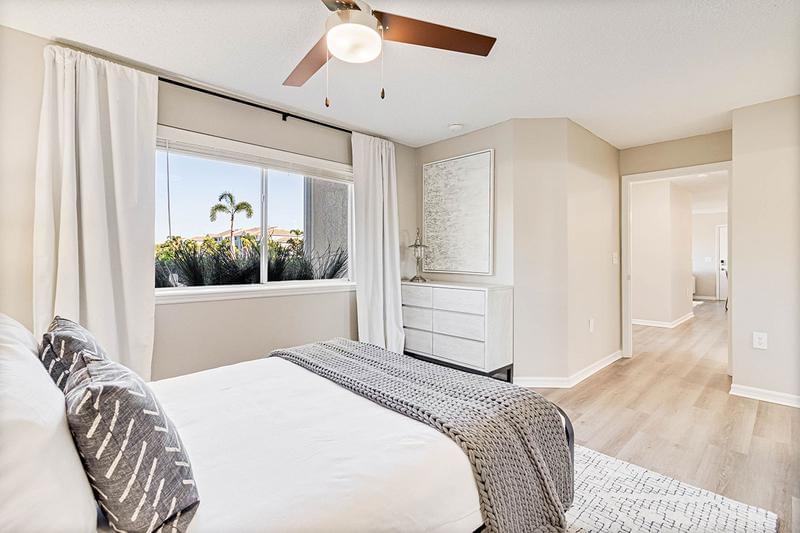 Master Bedroom | Ground floor master bedrooms feature wood-style flooring throughout.