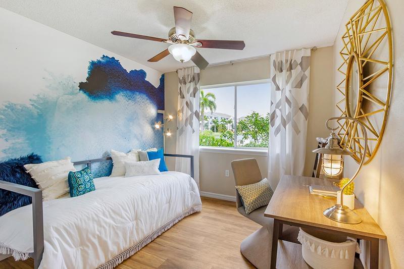 Guest Bedroom | Spacious guest bedrooms featuring large windows and ceiling fans.