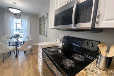 Stainless Steel Appliances | Kitchens feature stainless-steel appliances and granite-style countertops. Kitchens also open up to the separate dining area.