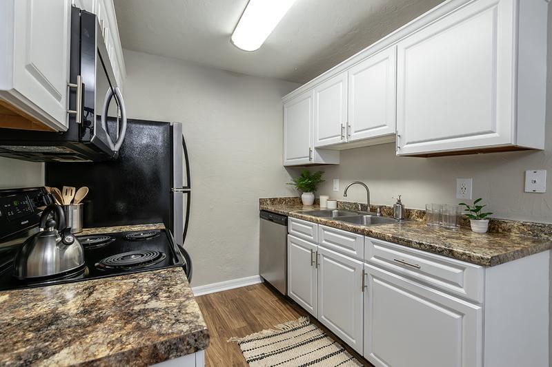 Galley-Style Kitchen | Our floor plans feature galley-style kitchens and ample cabinetry. 
