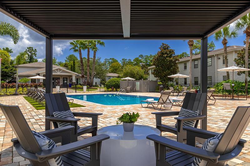 Poolside Pergola | Relax in the shade under our poolside pergola.