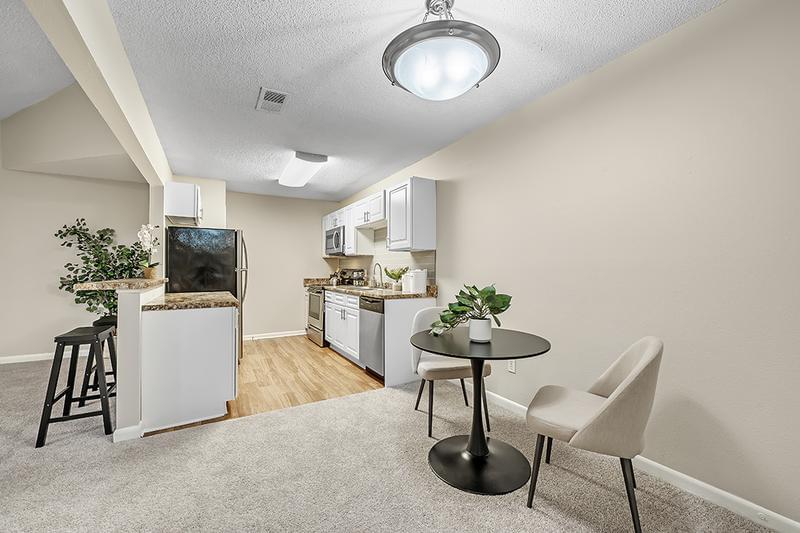Kitchen and Dining | Whether you're searching for a dinner with family, hosting a gathering with friends, or simply enjoying a cup of coffee, our separate dining area provides an ideal vantage point, enabling you to be a part of every conversation and activity in the heart of your home.