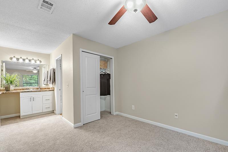 Master Bedroom | Master bedrooms feature spacious closets, a multi-speed ceiling fan, and an ensuite bathroom.