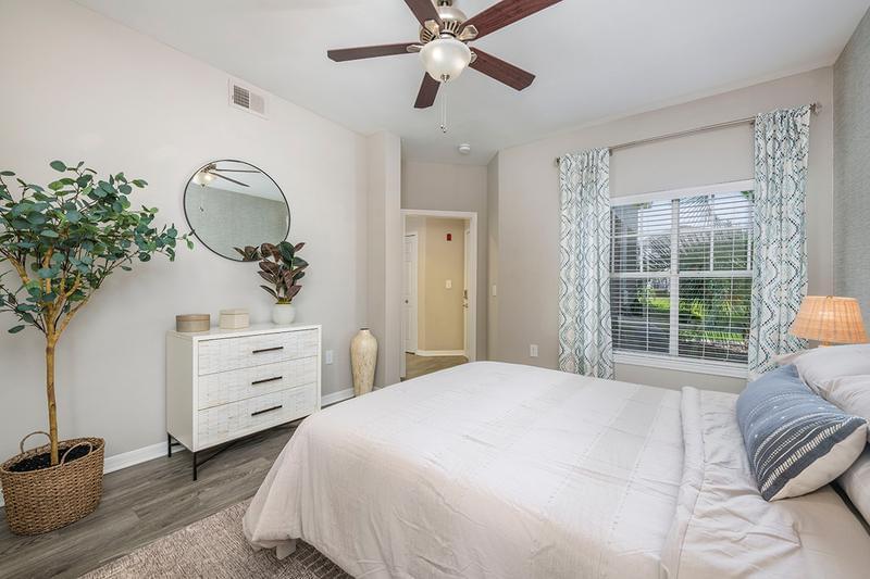 Guest Bedroom | Bedrooms feature wood-style flooring and spacious closets.