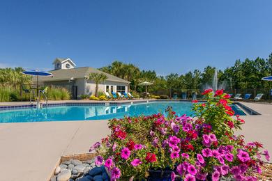 Pool Area | Come relax at the pool area featuring beautiful lush landscaping.