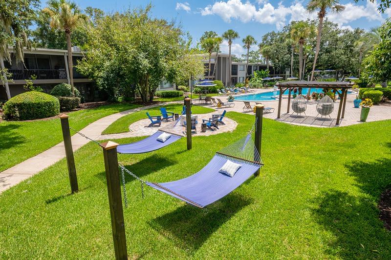 Outdoor Amenities | At Lakewood Village, you can enjoy plenty of outdoor amenities like a hammock garden, fire pit, and resort-style pool.